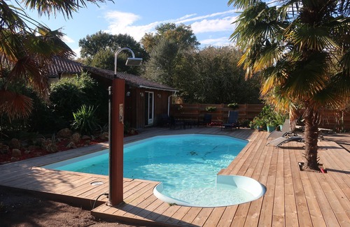 Leon House | Atypical wooden house with heated pool: Pine forest, ocean and calm