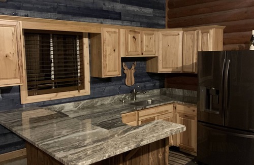 Frederic Cabin | Authentic log cabin on expansive private land—ideal for solitude or adventure