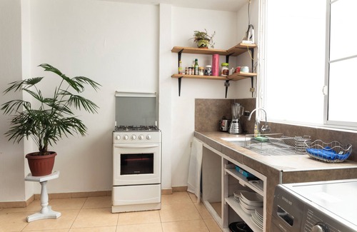Banos de Agua Santa Apartment | Baños Downtown Comfy apartment - work area & laundry