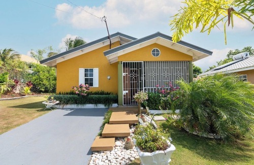 Mammee Bay House | Backyard Oasis in Drax Hall 70in TV