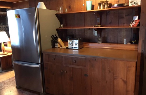 Rollingbay Cabin | Bainbridge Island Water's Edge Log Cabin just feet from the beach! Pet Friendly