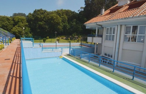 Isla Apartment | Bajo en la playa con piscina - La Arena 4203