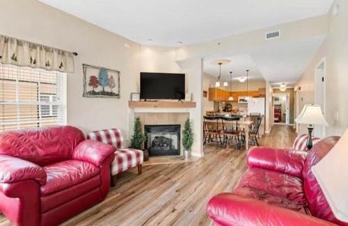 Pigeon Forge Apartment | Bandit's Riverfront Retreat - Mountain View- Condo-Fishing-Balcony-Fireplace-Great Location!