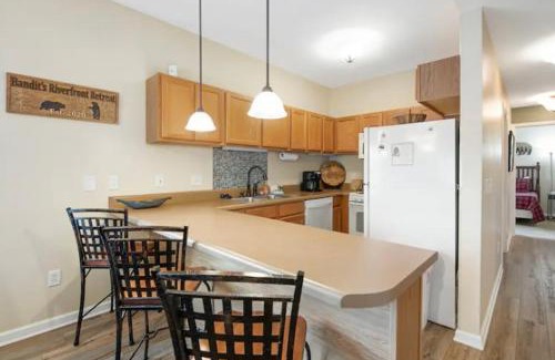 Pigeon Forge Apartment | Bandit's Riverfront Retreat - Mountain View- Condo-Fishing-Balcony-Fireplace-Great Location!