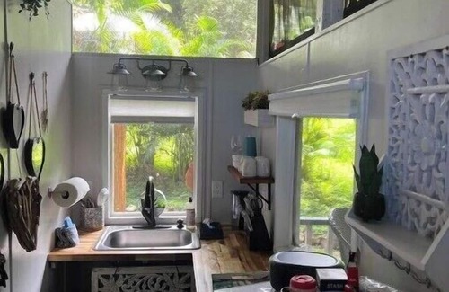 Kealakekua Cabin | Banyan Bungalow is nestled in the jungle and surrounded by a gorgeous landscape.