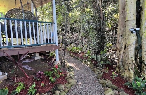 Kealakekua Cabin | Banyan Bungalow is nestled in the jungle and surrounded by a gorgeous landscape.