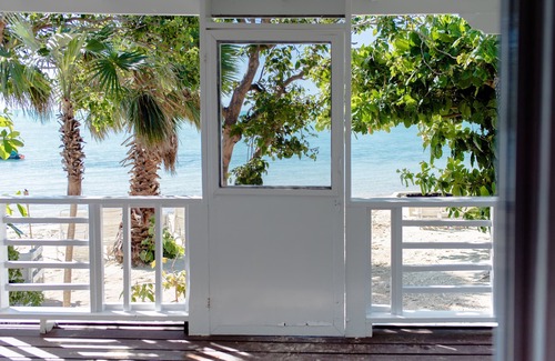 Leeward Settlement Cottage | Barefoot Luxury – Silver Palms Cottage # 1, Beachfront with Pool on Long Bay