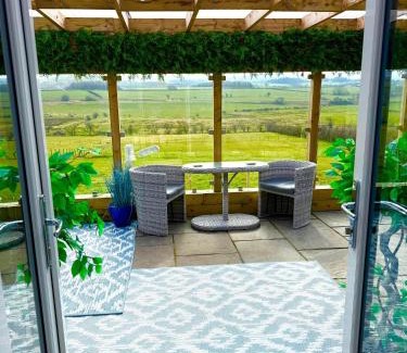 Cronberry House | Barlosh Barony Tpod Lodge Ayrshire, elec jacuzzi, BBQ, Firepit, Pizza Oven, indoor outdoor terrace with amazing views, spacious inside and out