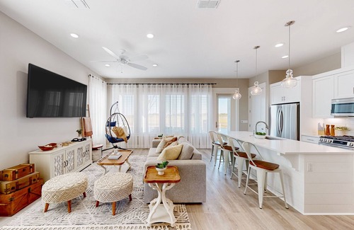 Rockport Villa | Bayfront resort villa with water view, pool, fishing pier, grills, & boardwalk