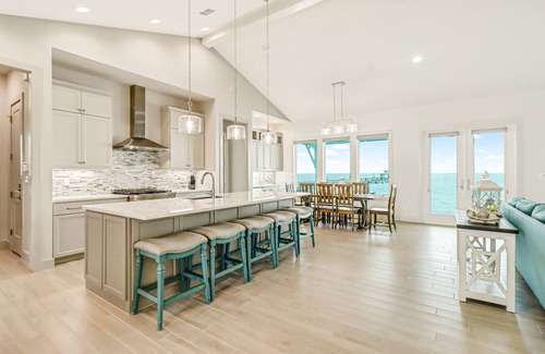 Rockport House | Bayfront water-view home with outdoor pool, lovely patio, hammock, fishing dock