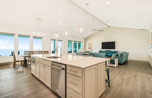 Rockport House | Bayfront water-view home with outdoor pool, lovely patio, hammock, fishing dock