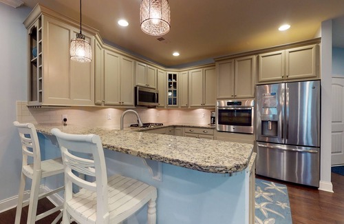 Bayside House | Bayside Resort townhouse w/free WiFi, pool, golf on-site, and fireplace