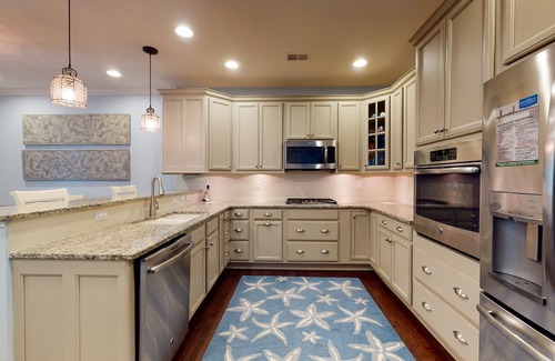 Bayside House | Bayside Resort townhouse w/free WiFi, pool, golf on-site, and fireplace