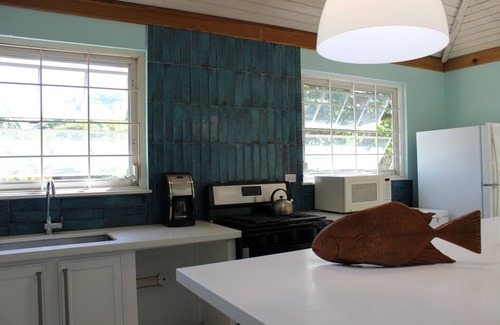 Runaway Bay Villa | Baywatch - seaside villa, modern, spectacular location & garden, pool, cook