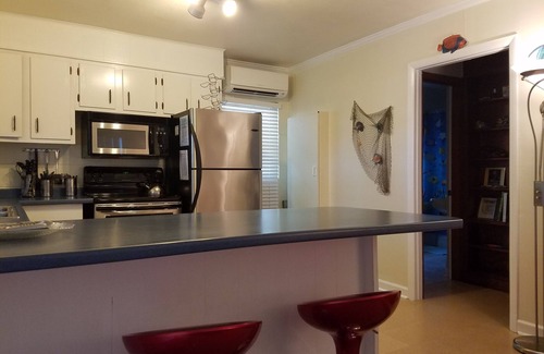 Savannah Beach Apartment | Beach-Chic Apt. for Two - SLEEP NUMBER BED - Porch Rockers - Short Walk to Beach