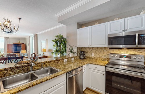 Panama City Beach Condo | Beach-chic corner condo with gorgeous Gulf views, pools, hot tub & game room