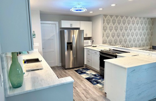 Singer Island House | Beach house in Paradise! Renovated throughout with pool. Steps to the beach