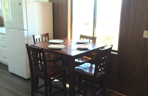 Clinton Cottage | Beach house with views of Puget Sound, ferry, North Cascades, Mt Baker, Rainier.
