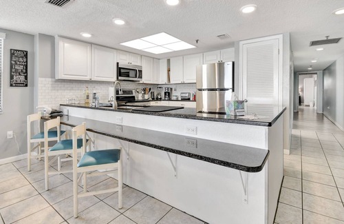 Madeira Beach Condo | BEACH LOUNGES AND UMBRELLA SERVICE INCLUDED! POOL IS OPEN AND PAVERS COMPLETED!