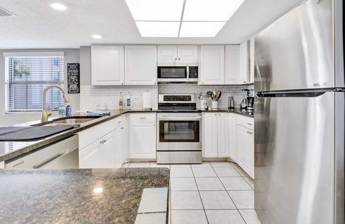 Madeira Beach Condo | BEACH LOUNGES AND UMBRELLA SERVICE INCLUDED! POOL IS OPEN AND PAVERS COMPLETED!
