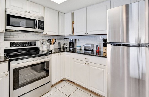 Madeira Beach Condo | BEACH LOUNGES AND UMBRELLA SERVICE INCLUDED! POOL IS OPEN AND PAVERS COMPLETED!
