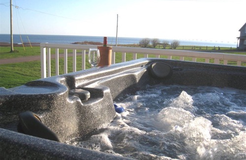 Borden-Carleton House | Beach Paradise! Unmatchable Sunsets, Hot Tub, Luxurious Ocean View, A/C, & more!