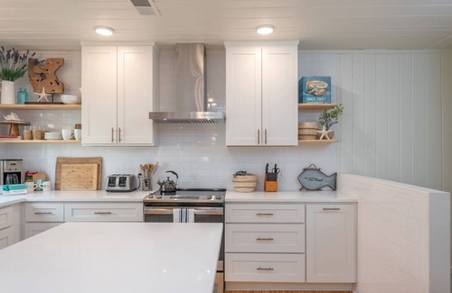 Tybee Island House | Beach Therapy: Stylish Cottage with Private Courtyard, Wrap-Around Porches, and Modern Decor.