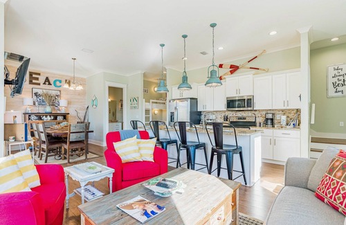 Gulf Shores Cottage | Beach-view cottage near beach with pool, wrap-around balcony, boat dock, W/D, AC