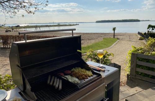 Hulshorst Villa | BEACH VILLA in erster Reihe - direkter Strandzugang - eingezäunter Garten - Dachterrasse - 2 Gartenterrassen - Terrassendach - Grill mit Plancha - XXL Meerblick - Bar - SONOS Soundanlage - Pool Whirlpool - kinderfreundlich - Hunde willkommen