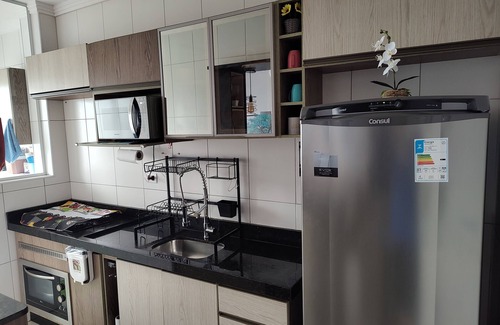 Praia Grande Apartment | Beachfront condominium, 1-bedroom apartment with views of the mountains and sunset
