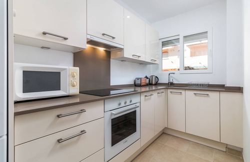 Estepona Apartment | Beachfront apartment with air-con, large sun-terrace (& loungers), WiFi & UKTV