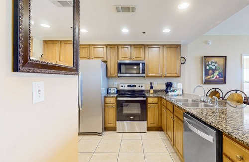 West Panama City Beach Condo | Beachfront corner condo with sweeping Gulf view, pools/hot tub & gym