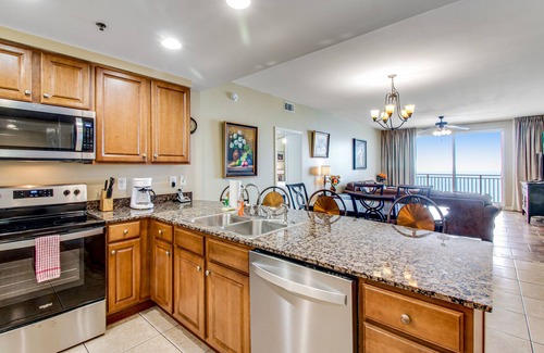 West Panama City Beach Condo | Beachfront corner condo with sweeping Gulf view, pools/hot tub & gym