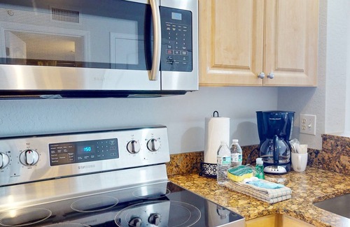 Treasure Island Condo | Beachfront Condo. Heated Pool. Activities, Fun, End Unit, Parking, & Great Location!