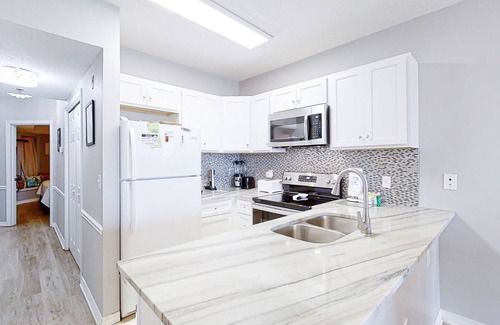 Gulf Shores Condo | Beachfront Dog-Friendly Condo w/Balcony, Shared Pool, Sauna, Basketball, Gym