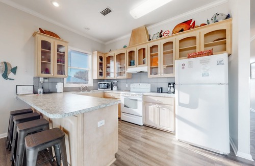 Plantation House | Beachfront dog-friendly home with private hot tub, boardwalk, on-site pools, gym