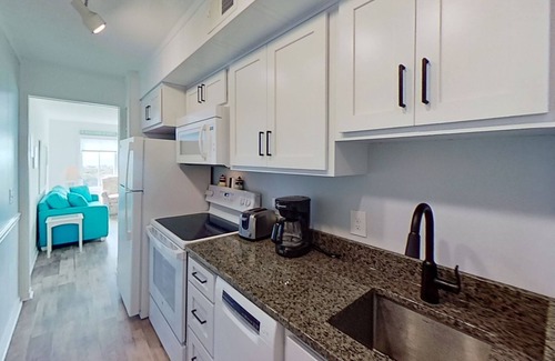 Morehead City Condo | Beachfront home with ocean-view balcony, two pools, waterslide, & beach access