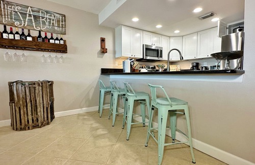Indian Shores Condo | Beachfront Paradise, Retro Twist, Exquisite Views, Private Entrance, EV Car Charger!