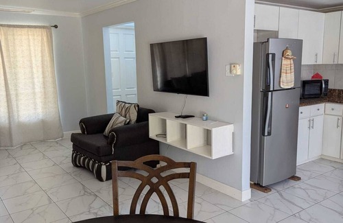 Orange Bay House | Beachfront Townhome at Little Bay Country Club: Pool, Beach, Backyard & More!