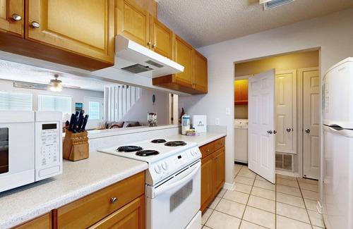 Sugar Beach House | Beachfront townhome w/on-site beach access, heated pool, patio, grill, AC, W/D