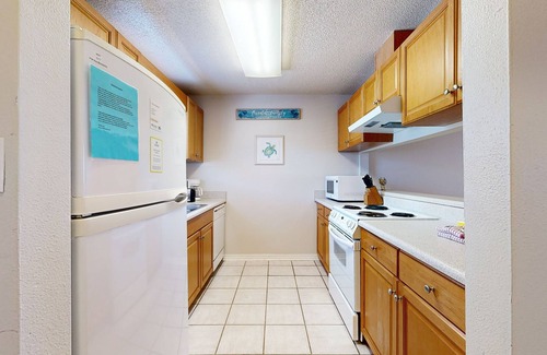Sugar Beach House | Beachfront townhome w/on-site beach access, heated pool, patio, grill, AC, W/D