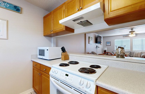 Sugar Beach House | Beachfront townhome w/on-site beach access, heated pool, patio, grill, AC, W/D