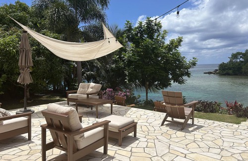 Orange Bay Villa | Beachhouse Villa located on a small bluff on a private beach. Ideal for families