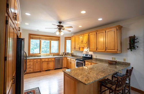 Wild Rose House | Beautiful 8000 Sq. Ft. Log Home With 250 Feet Of Private Frontage on Kusel Lake