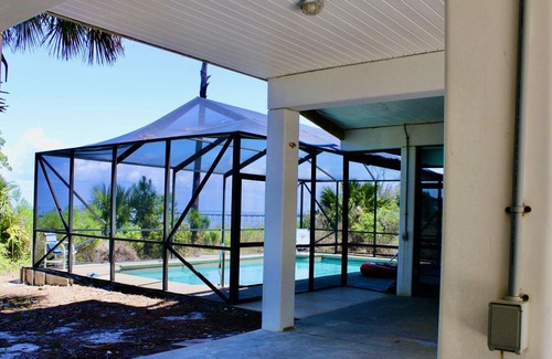 Plantation House | Beautiful Bayfront home with dock, elevator, private pool, & more.