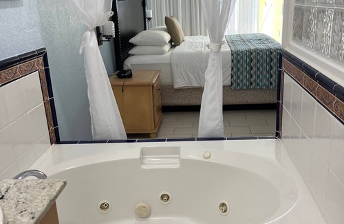 Colliers Bay Apartment | Beautiful beach front spacious studio apartment with private oceanfront patio.