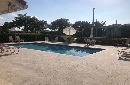 Hamptons at Boca Raton House | Beautiful Boca Home for Snowbirds & Families enjoy the pool pickleball & tennis