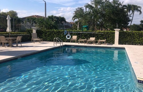 Hamptons at Boca Raton House | Beautiful Boca Home for Snowbirds & Families enjoy the pool pickleball & tennis