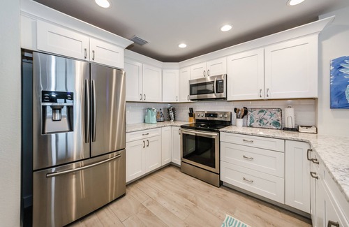 Indian Shores Condo | Beautiful coastal decor 3 bed, 2 bath gulf front condo with magical sunsets!