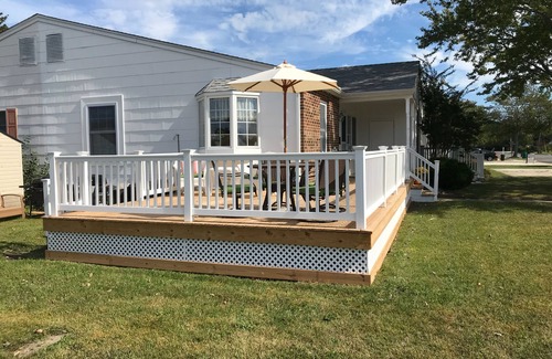 Village Green House | Beautiful corner property with cozy beach vibe.